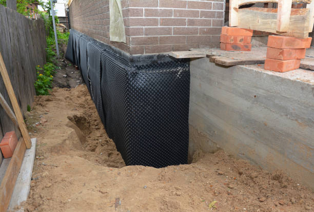Happy homeowners after waterproofing job in Helmsburg
